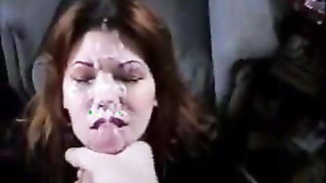 In this video, a clothed milf receives a massive facial from her partner, leaving her face covered in a huge amount of cum.