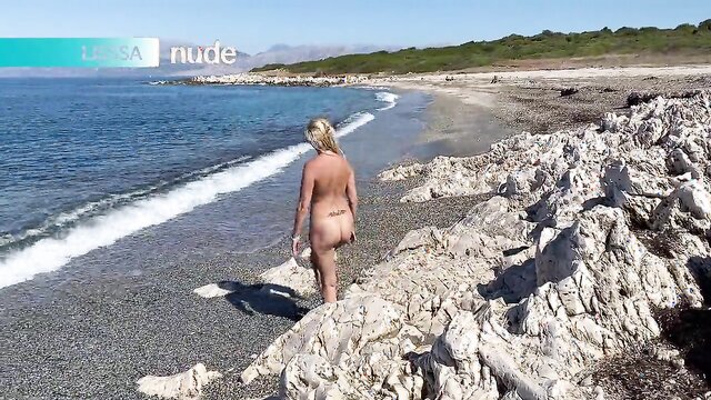 Lissa flaunts her tattooed body and pees on the beach in this explicit video.