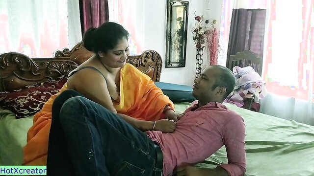 In this scorching video, an enticing Indian woman invites a repairman into her home, leading to a steamy encounter on her bed.