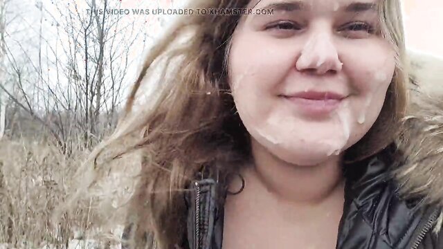 In this steamy video, a delighted cutie gives a skillful blowjob while enjoying a car ride in the great outdoors, leading to a facial of cum on her ample assets.