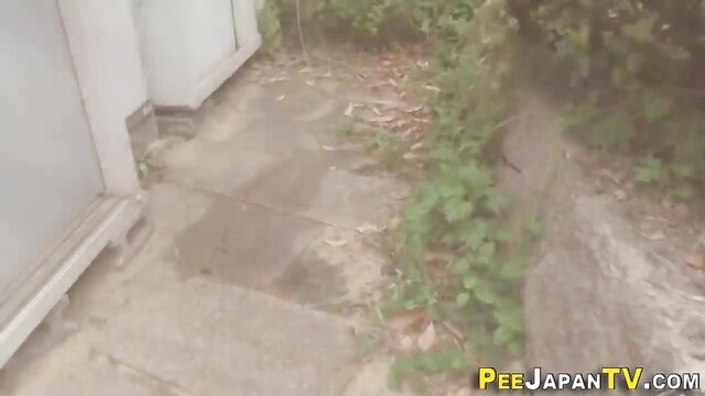 PISS JAPAN TV - Asian pees in her clothes outdoors Asian pees in her clothes outdoors in public street while running